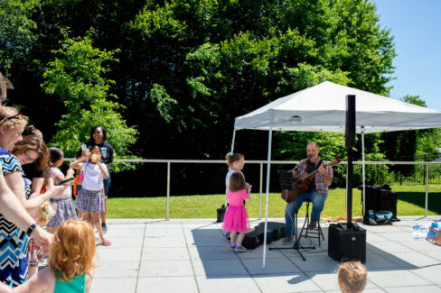 Families watch a live performance by Mr. Fite.
